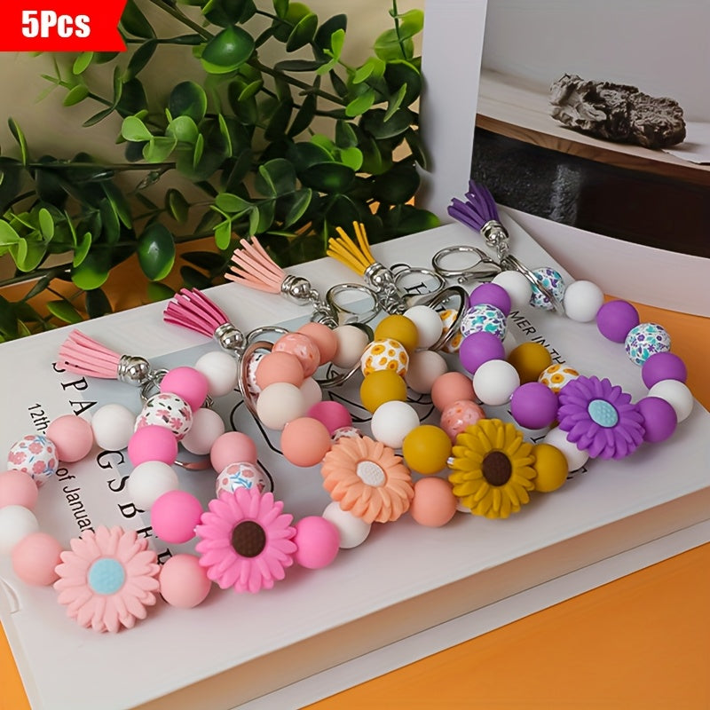 A 5pcs Collection Featuring a Daisy Flower Silicone Keychain And Printed Wooden Beads, Ideal for Holiday Gifting