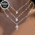 This Collection Features Three Stylish Lip Cross Necklaces Made of 925 Sterling Silver, Adorned with Shimmering Synthetic Cubic Zirconia And a Heart-Shaped Charm. The Exquisite Coconut Snowflake Chain Complements The Cubic Zirconia Necklace