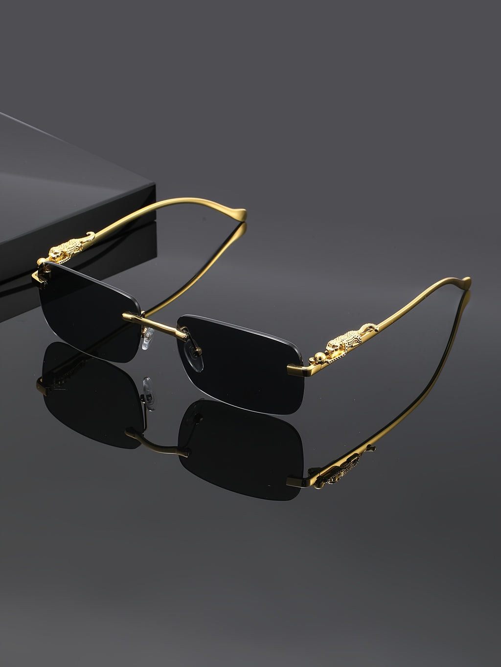 A Unique Pair of Glasses with Leopard Print Design And Frameless Square Lenses, with Glasses Case And Cleaning Cloth Suitable for Casual Gatherings And Fashionable Outfits. They Are a Perfect Photo Prop for Both Men And Women