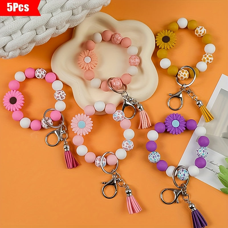 A 5pcs Collection Featuring a Daisy Flower Silicone Keychain And Printed Wooden Beads, Ideal for Holiday Gifting