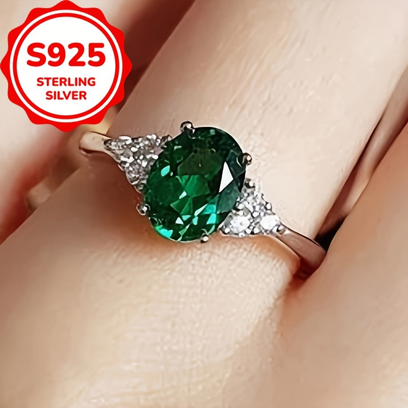 An elegant S925 sterling Silvery ring adorned with vibrant green oval shaped synthetic Synthetic Zirconia, perfect for weddings or grand events - an eternal gift for her anniversary