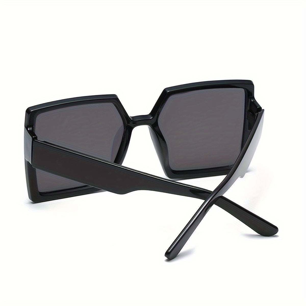 A Pair of Women'S Black And Gray Oversized Fashionable Glasses That Create a Dramatic Effect And Exude a Sense of High-End Style