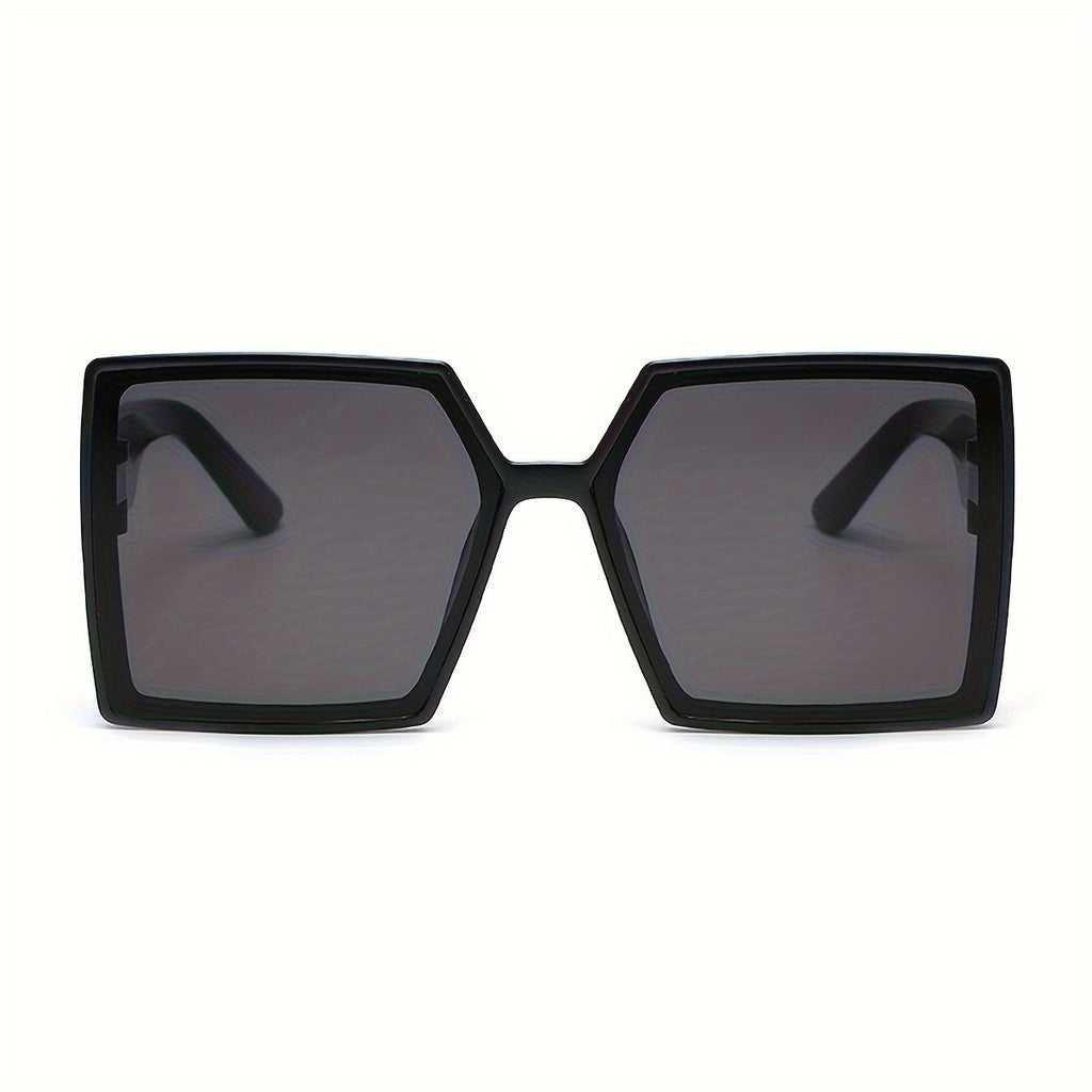A Pair of Women'S Black And Gray Oversized Fashionable Glasses That Create a Dramatic Effect And Exude a Sense of High-End Style