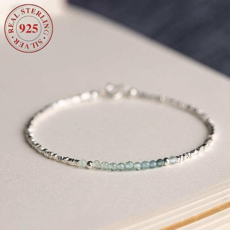 A Delicate Women'S Bracelet Made of 925 Silvery with a Fine Silvery Aquamarine Design, Showcasing a Light Luxury Aesthetic And a Unique Broken Style