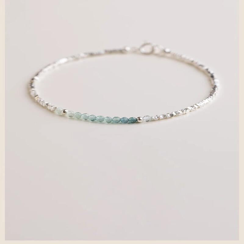 A Delicate Women'S Bracelet Made of 925 Silvery with a Fine Silvery Aquamarine Design, Showcasing a Light Luxury Aesthetic And a Unique Broken Style