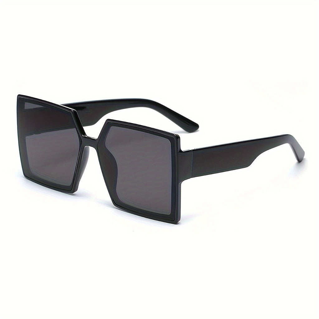 A Pair of Women'S Black And Gray Oversized Fashionable Glasses That Create a Dramatic Effect And Exude a Sense of High-End Style