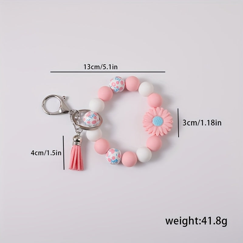 A 5pcs Collection Featuring a Daisy Flower Silicone Keychain And Printed Wooden Beads, Ideal for Holiday Gifting
